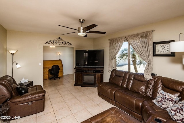 living room with ceiling fan and light tile patterned floors