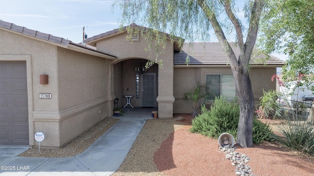 2780 Shasta Ln, Lake Havasu City, AZ 86403 - entrance to property with a tiled roof, an attached garage, and stucco siding