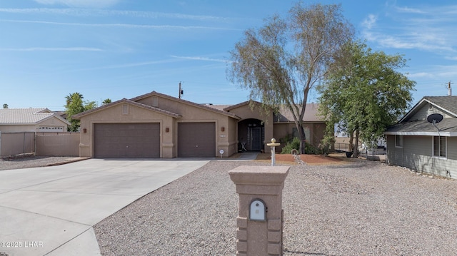 2780 Shasta Ln, Lake Havasu City, AZ 86403 - ranch-style home featuring a garage, fence, stucco siding, and concrete driveway