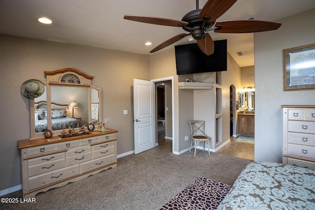 2780 Shasta Ln, Lake Havasu City, AZ 86403 - bedroom with carpet flooring, connected bathroom, arched walkways, recessed lighting, and baseboards