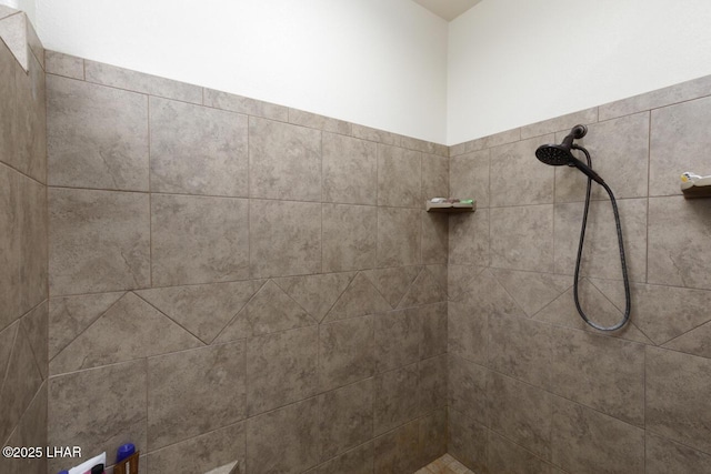 full bath featuring tiled shower