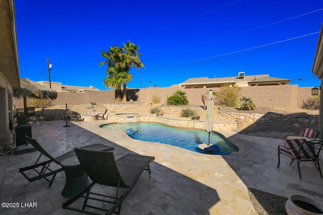 view of pool with a patio, a fenced backyard, a fenced in pool, and an in ground hot tub