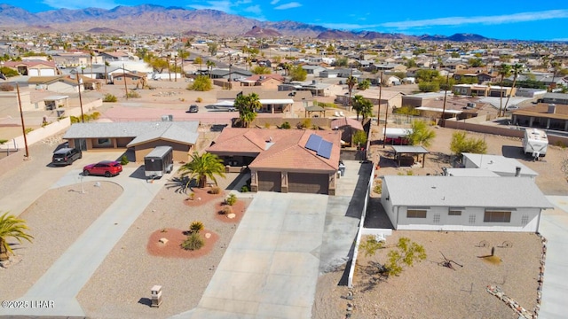 drone / aerial view featuring a mountain view and a residential view