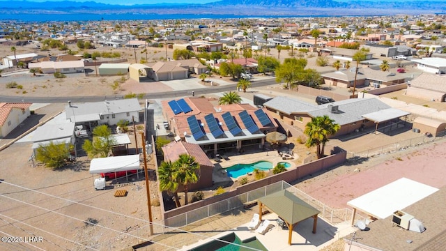 birds eye view of property with a residential view and a mountain view