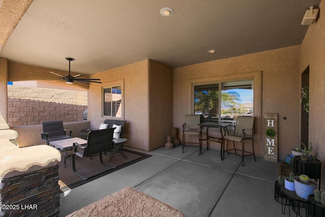 view of patio / terrace featuring ceiling fan