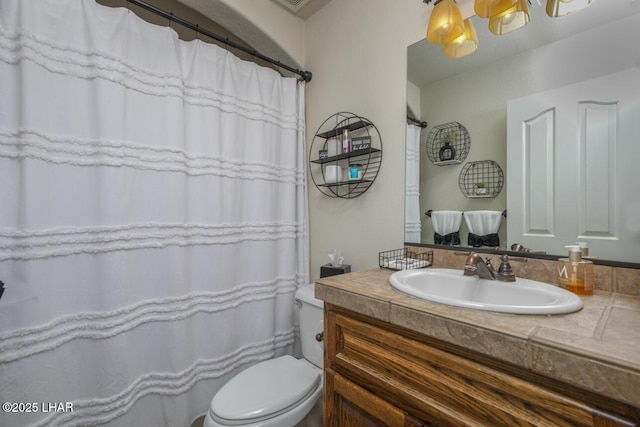 full bathroom featuring toilet and vanity