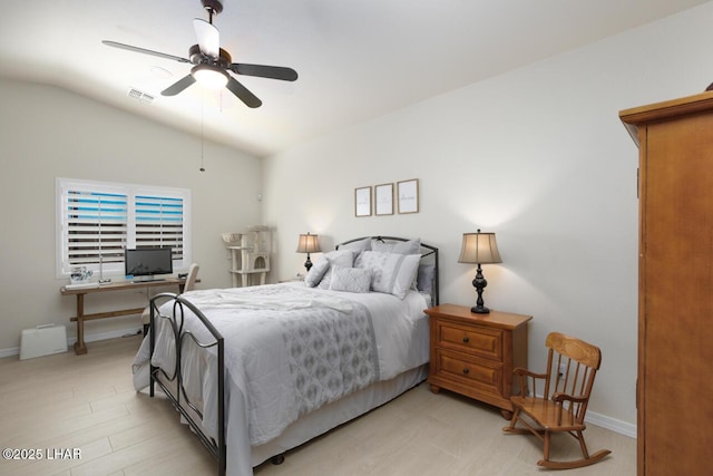 bedroom featuring visible vents, vaulted ceiling, light wood finished floors, and baseboards