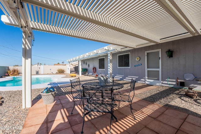 view of patio / terrace with a fenced in pool and a pergola