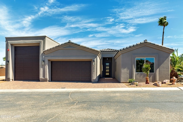 view of front of home with a garage