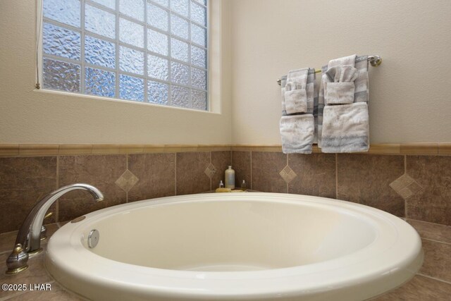 bathroom with a garden tub