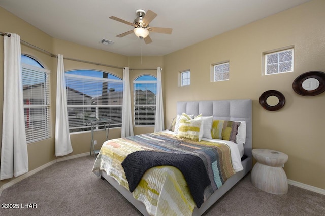 bedroom with carpet flooring, baseboards, a ceiling fan, and visible vents