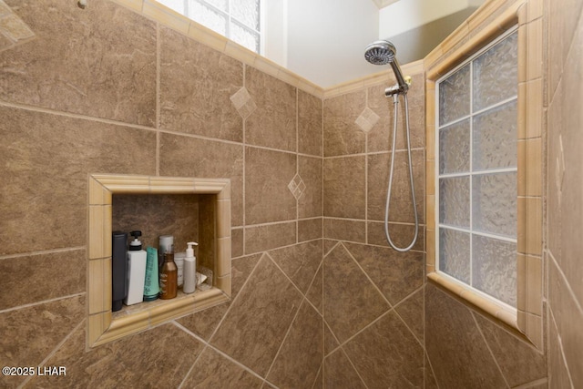 full bath with a tile shower