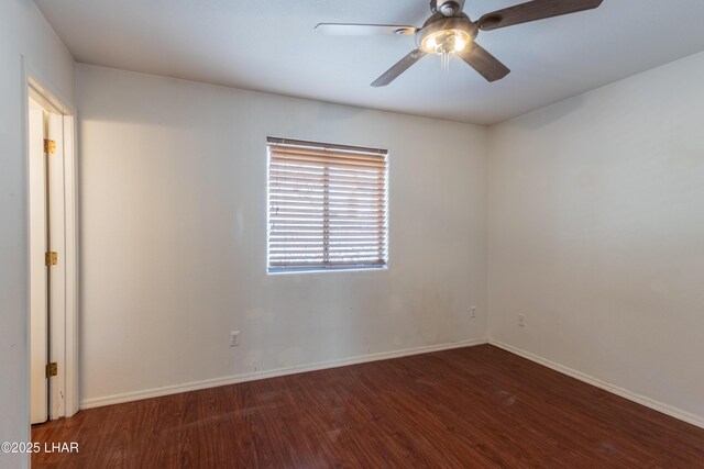 unfurnished room with ceiling fan, baseboards, and wood finished floors