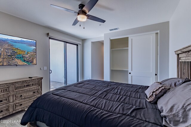 bedroom featuring wood-type flooring and ceiling fan