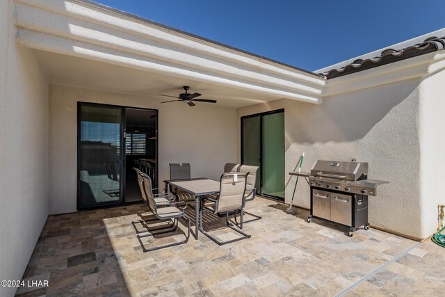 view of patio featuring ceiling fan and a grill