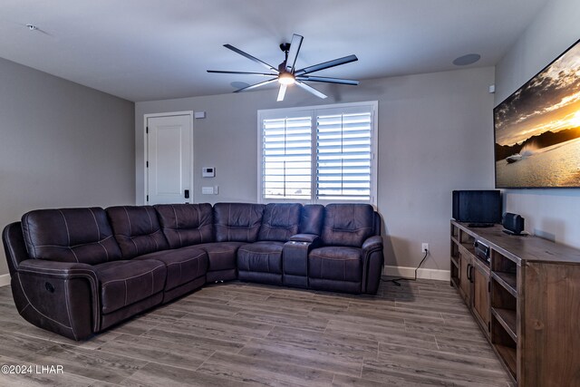 living room featuring hardwood / wood-style flooring and ceiling fan