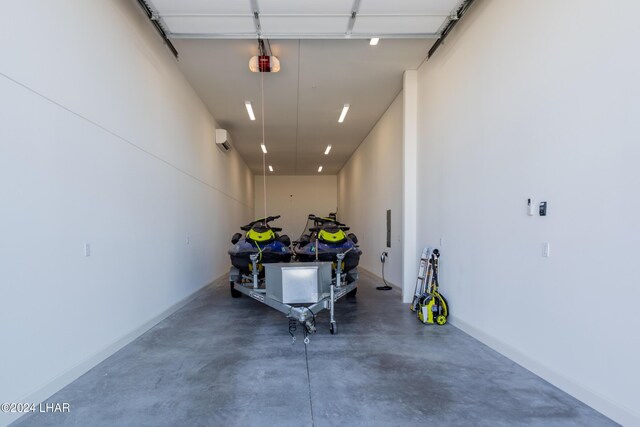 garage featuring an AC wall unit