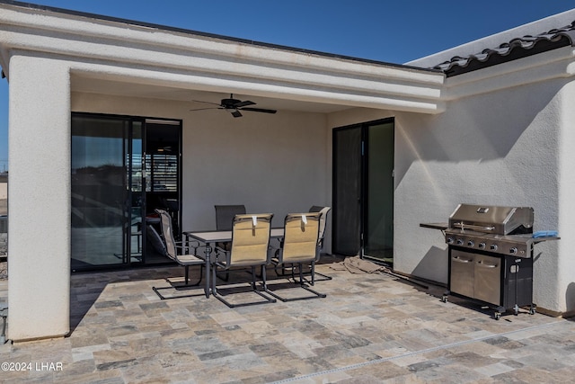 view of patio with ceiling fan and a grill