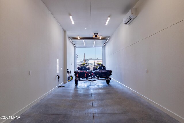 garage featuring a wall mounted air conditioner