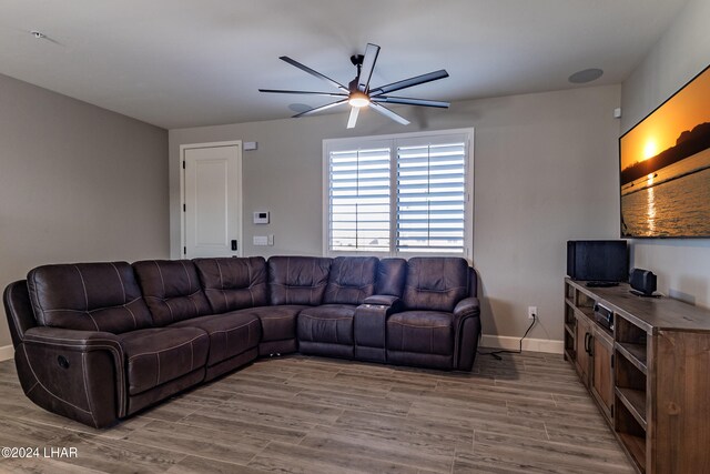 living room with hardwood / wood-style flooring and ceiling fan