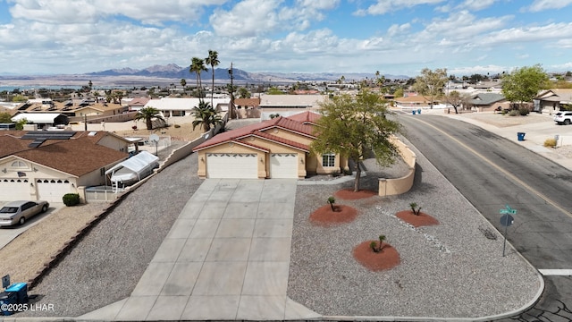 bird's eye view featuring a mountain view and a residential view