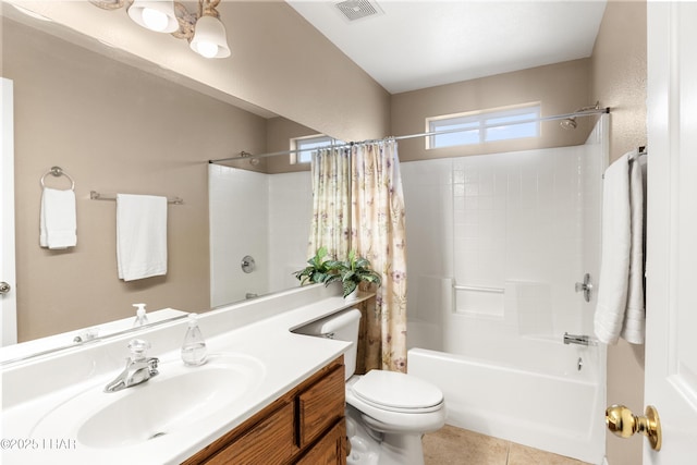 bathroom featuring vanity, visible vents, shower / tub combo, tile patterned floors, and toilet