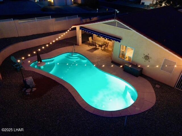 view of pool featuring a patio area, a fenced in pool, and fence