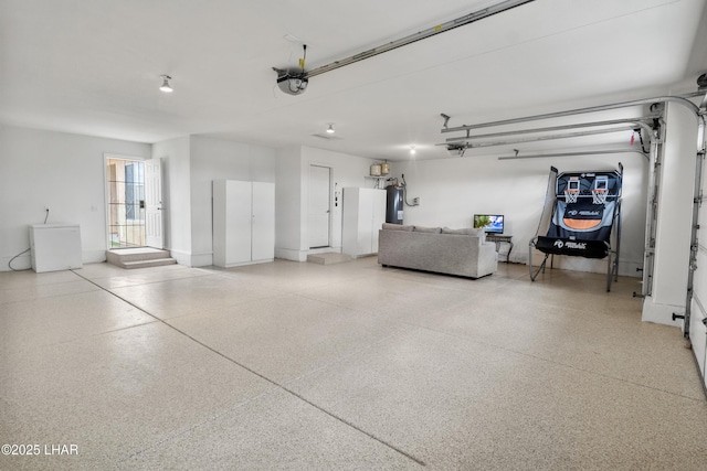 garage with fridge, a garage door opener, and electric water heater