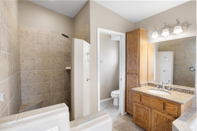 full bath featuring tile patterned flooring, toilet, vanity, and walk in shower