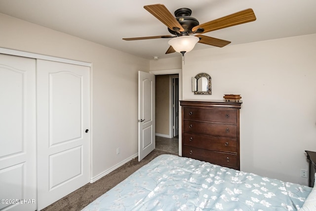 carpeted bedroom with a closet and ceiling fan