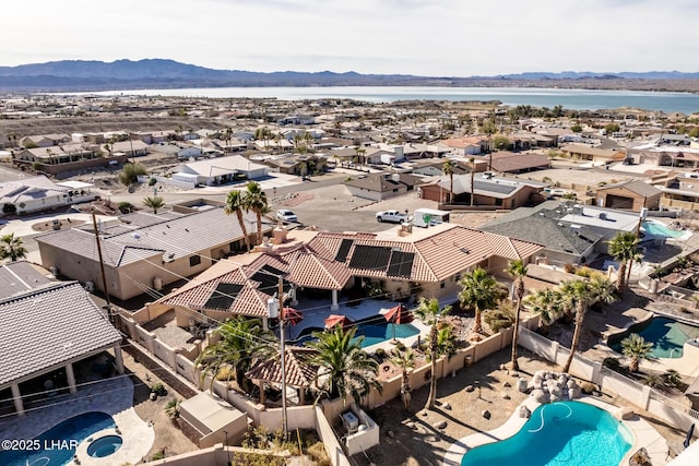 birds eye view of property featuring a water and mountain view