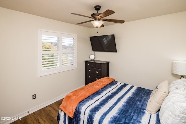 bedroom featuring dark wood-type flooring and ceiling fan