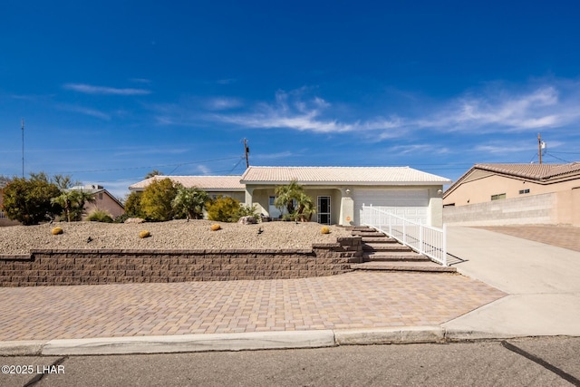 single story home with a garage