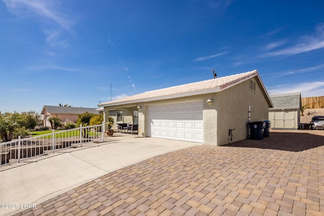 view of side of home featuring a garage