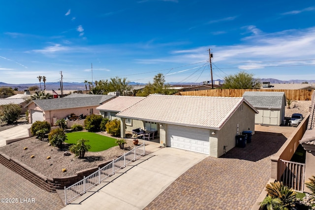 ranch-style house featuring a front yard and a garage