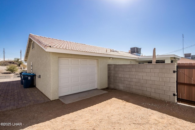 garage featuring central AC unit