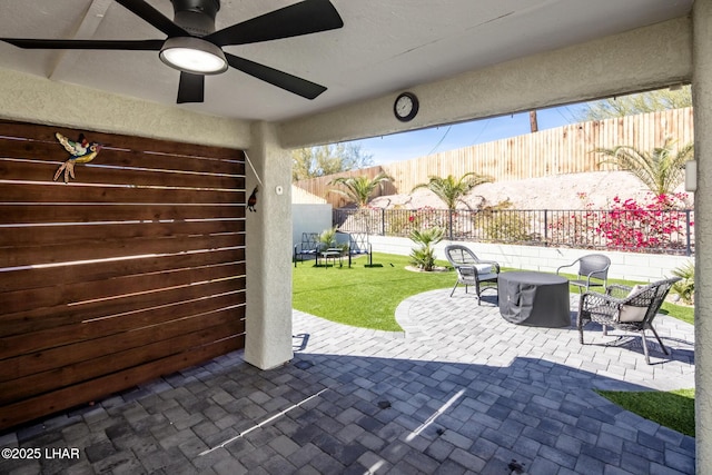 view of patio / terrace featuring ceiling fan