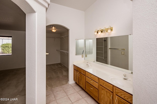 bathroom with vanity and tile patterned flooring