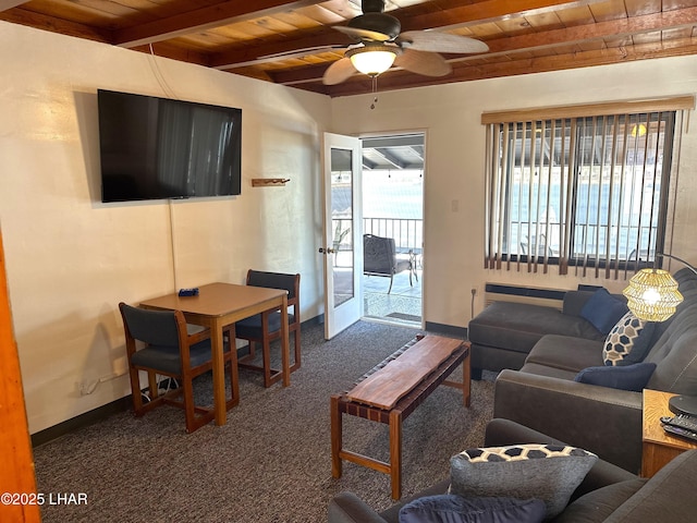 9378 Riverside Dr, Parker, AZ 85344 - living area with wooden ceiling, dark colored carpet, beam ceiling, baseboards, and ceiling fan