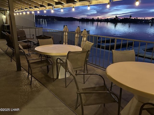 9378 Riverside Dr, Parker, AZ 85344 - view of patio / terrace featuring a water view, outdoor dining area, and a balcony