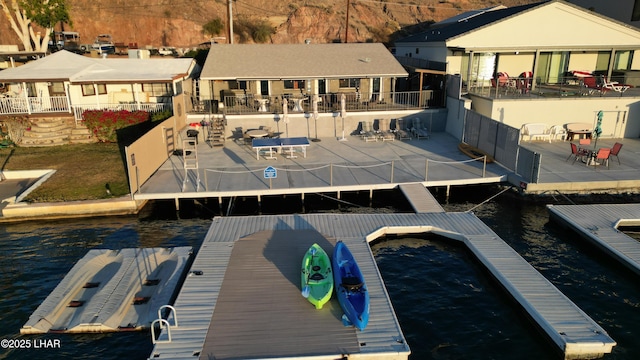 9378 Riverside Dr, Parker, AZ 85344 - dock featuring fence, a patio area, and a water view