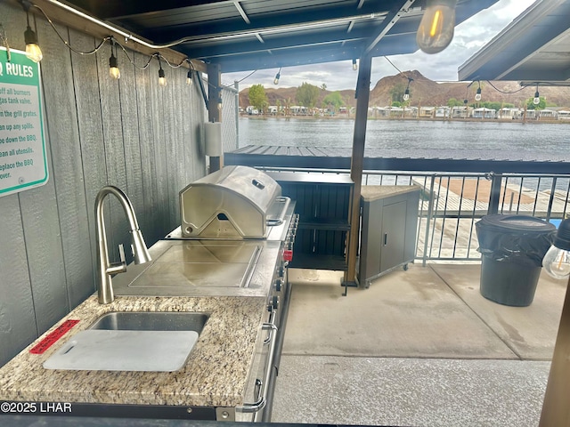 9378 Riverside Dr, Parker, AZ 85344 - view of patio / terrace with a sink and a water view