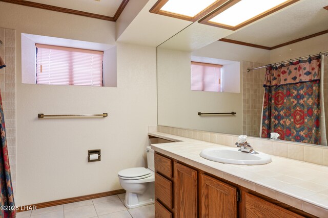 full bathroom with vanity, a shower with shower curtain, crown molding, toilet, and tile patterned floors