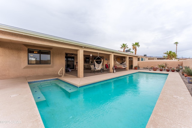 view of swimming pool with a fenced backyard, a fenced in pool, and a patio