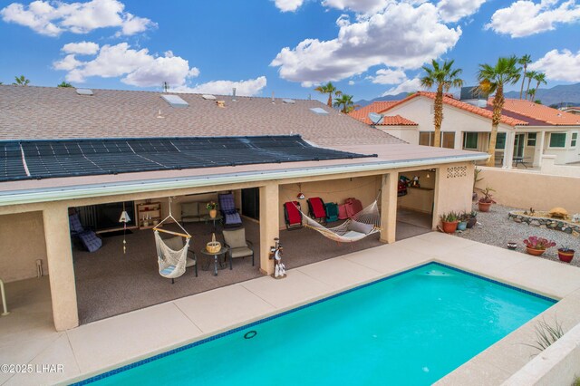 pool with a patio area