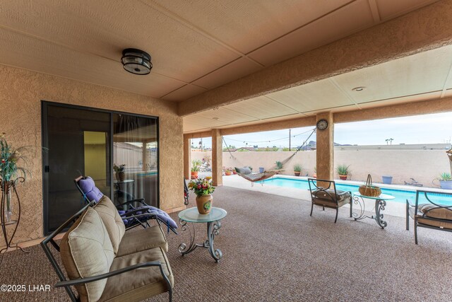 view of patio / terrace featuring a fenced backyard and a fenced in pool