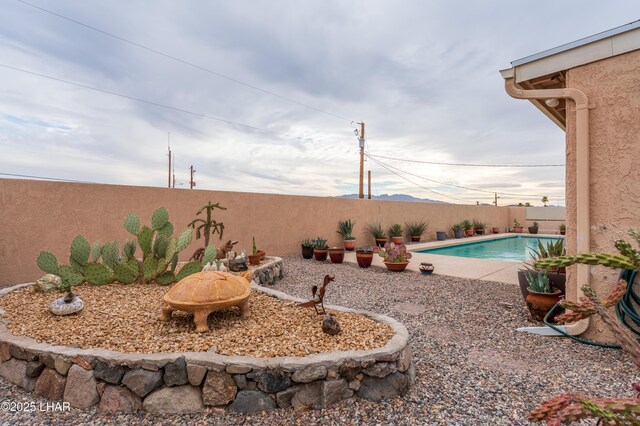 view of yard with a fenced in pool and a fenced backyard