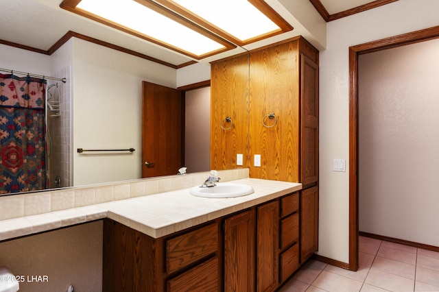 full bath featuring vanity, baseboards, tile patterned flooring, curtained shower, and crown molding