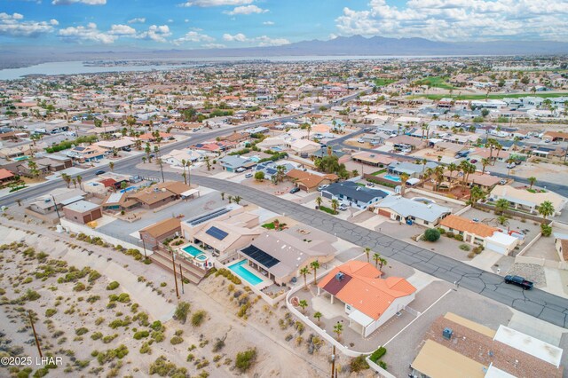 drone / aerial view featuring a residential view and a mountain view