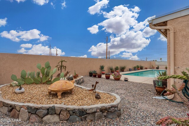 view of yard featuring a fenced backyard and a fenced in pool